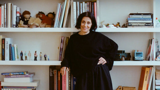 Araks Yeramyan in front of bookshelf