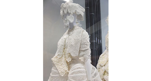 White lace placed on a mannequin.