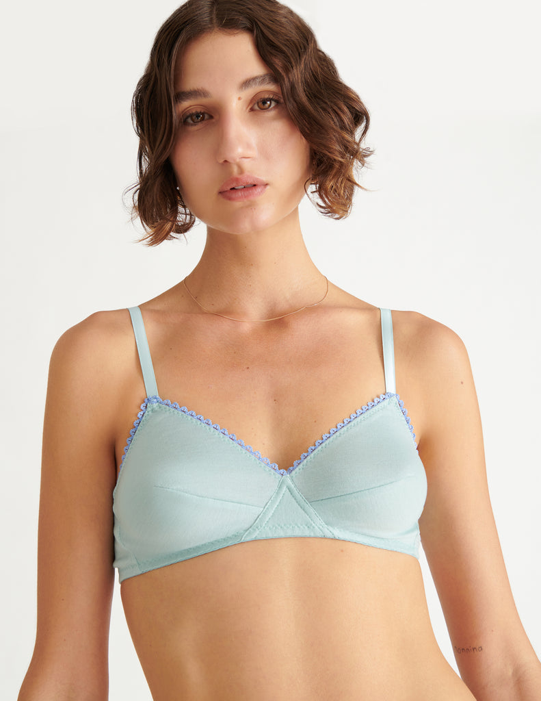 a model in the antonia bralette in nimbus blue