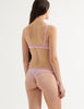 a model from the back in the antonia bralette and stella thong in slipper pink