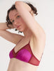 a model in the beatrice bralette in amaranth magenta and red