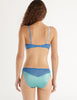 back of woman in blue silk Beatrice Bralette and Aaron Panty