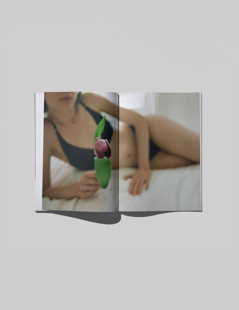 an image of a model on a bed inside the book in between by chloe horseman