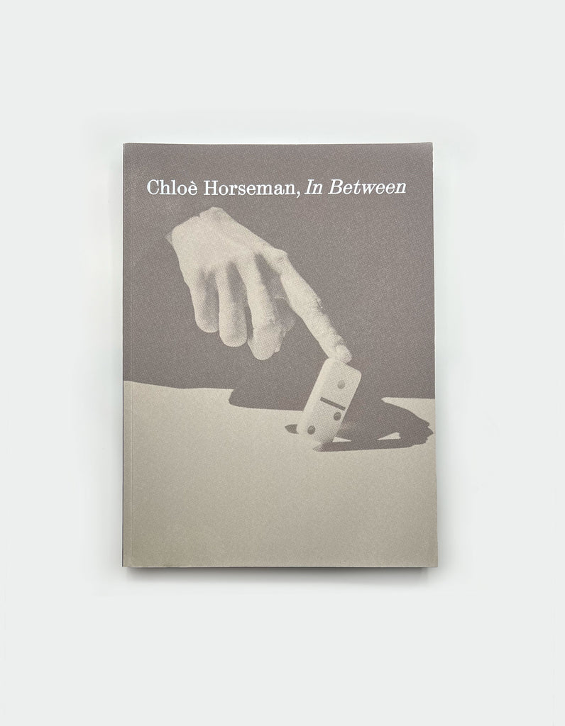 a flat image of the book in between by chloe horseman