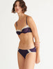 a model in the chloe underwire bra and sonja panty in calla purple