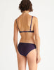 a model in the chloe underwire bra and sonja panty in calla purple