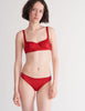 a model in the gita underwire bra and grier thong in cardinal red