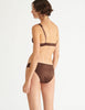 a model in the gita underwire bra and gwyneth panty in carob brown