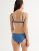 back view of model in elias bikini to and ezra bikini bottom in fog blue 