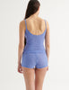 a back photo of a model in the georgia cami and guinevere shorts in serene blue