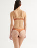 a model in the gita underwire bra and grier thong in cocoa brown