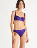 a model in the gita underwire bra in aster purple