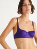 a model in the gita underwire bra in aster purple