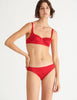 a model in the gita underwire bra and gwyneth panty in cardinal red