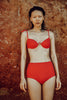 a model in the myriam underwire bikini top in poppy red and the mallory hipster in poppy red