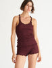 a model in the kinee tank and kat short in plum