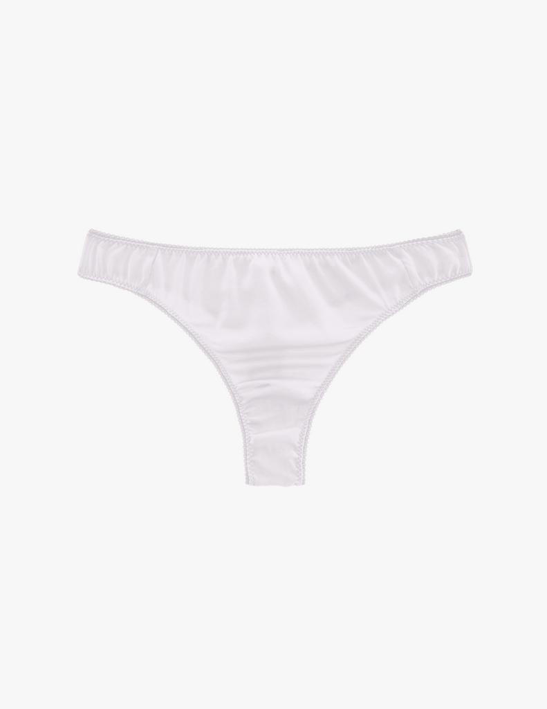 Flat of white silk thong