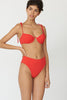 a model in the myriam underwire bikini top in poppy red and the mallory hipster in poppy red