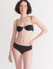 a model in the ovsanna bikini top and ezra bikini bottom in black