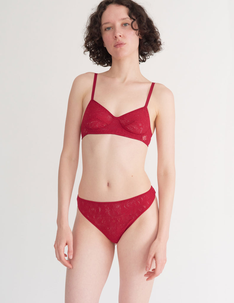 a model in the tamara bralette and tine thong in cardinal red