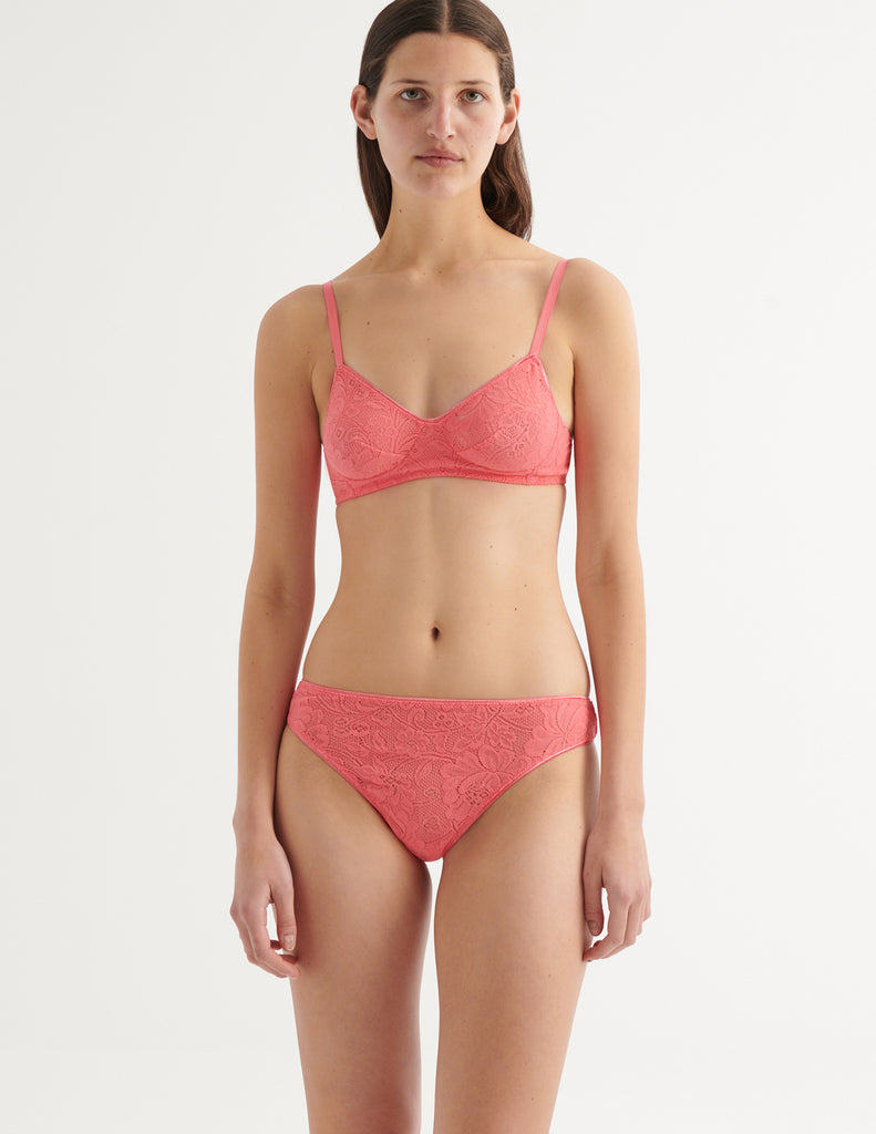 a model in the tamara bralette and tine thong in prima pink