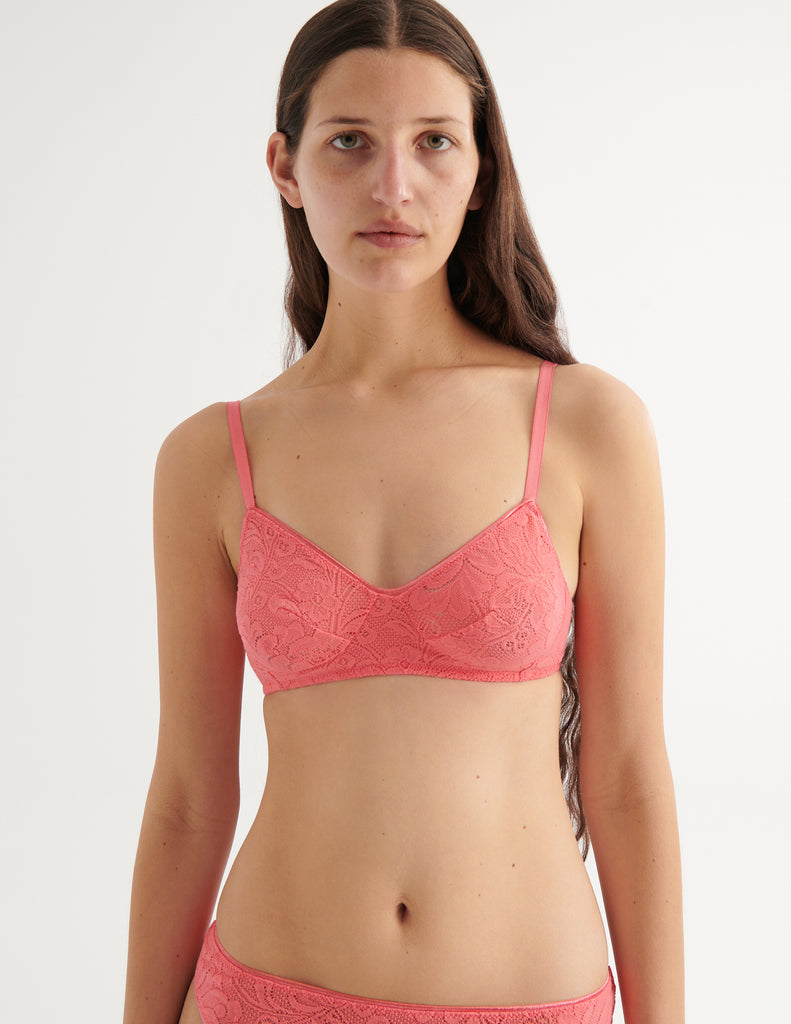 a close up of a model in the tamara bralette and tine thong in prima pink