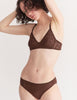 a model in the tamara bralette and tris panty in carob brown