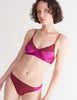 a model in the willow bralette and maude thong in amaranth magenta