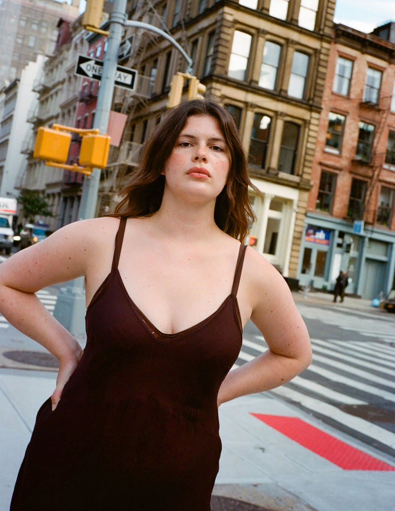 a model wearing the cadel in brown silk