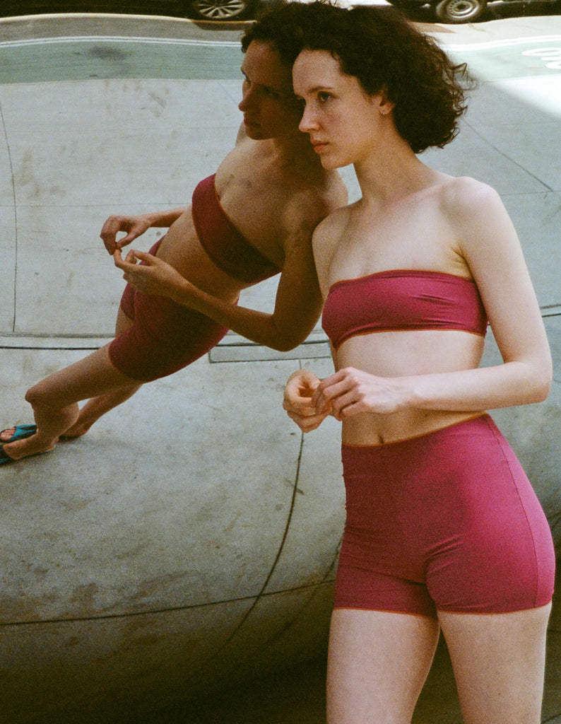 a model wearing the louie shorts in maroon