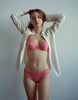 a model wearing the sofia bra in pink cotton