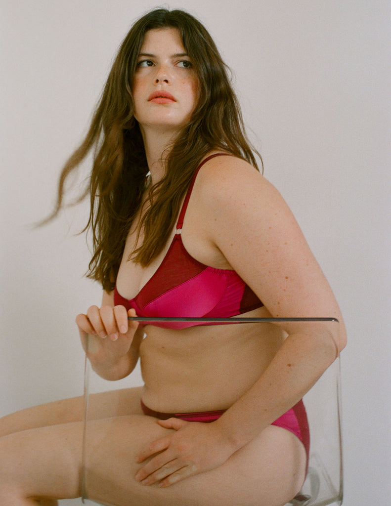 a model wearing the willow bralette in amaranth magenta